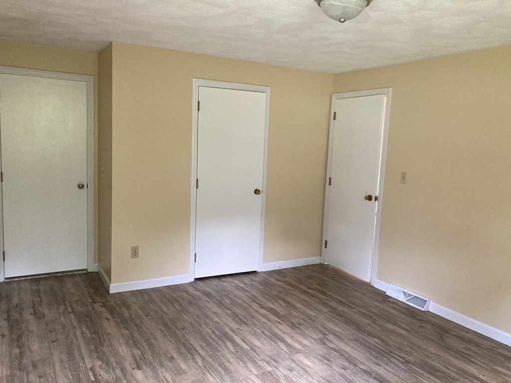 190 Fox Hill Road Burlington, MA 01803 - Photo 10 of 13 a view of an empty room with wooden floor