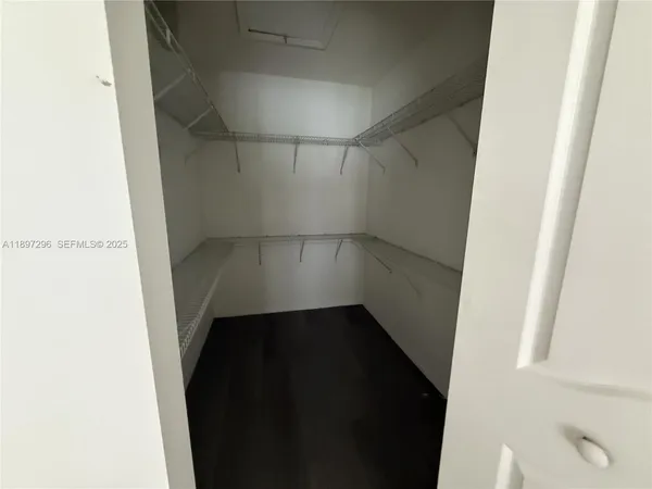a view of an empty walk in closet