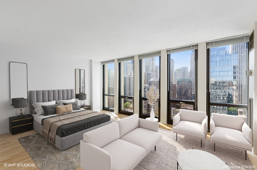 1 East Scott Street, Unit 2307 Chicago, IL 60610 - Photo 2 of 14 a bedroom with furniture and large windows