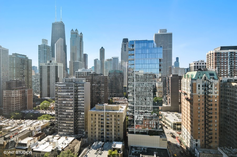 1 East Scott Street, Unit 2307 Chicago, IL 60610 - Photo 12 of 14 a view of a city with tall buildings