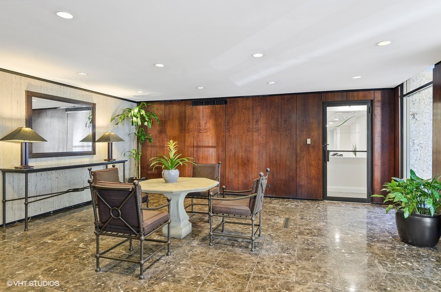 1 East Scott Street, Unit 2307 Chicago, IL 60610 - Photo 13 of 14 a dining room with furniture and window