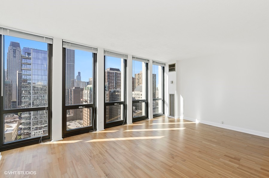1 East Scott Street, Unit 2307 Chicago, IL 60610 - Photo 4 of 14 a view of an empty room with glass door
