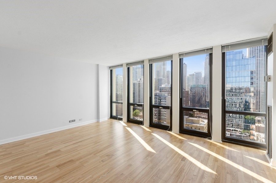 1 East Scott Street, Unit 2307 Chicago, IL 60610 - Photo 5 of 14 a view of an empty room with glass door