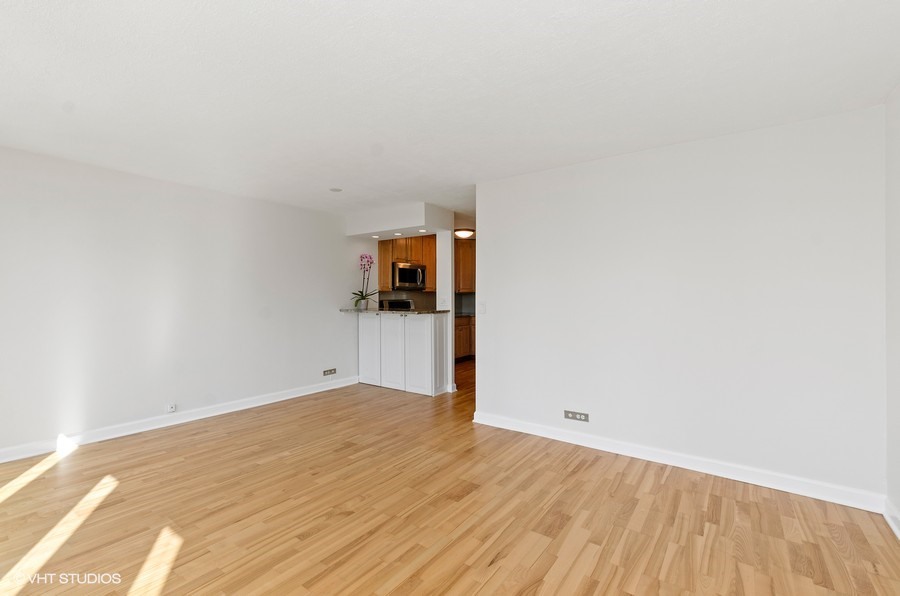1 East Scott Street, Unit 2307 Chicago, IL 60610 - Photo 6 of 14 a view of a room with wooden floor