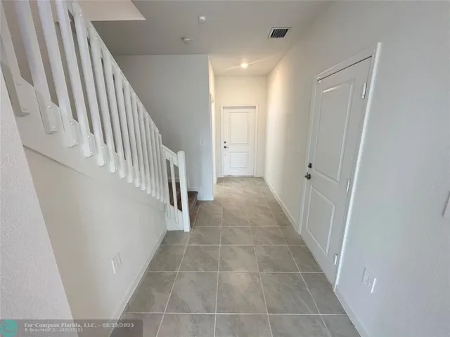 a view of hallway with stairs