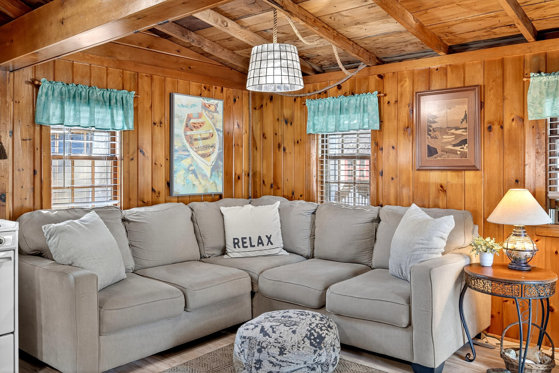 262 Old Wharf Road, Unit U27 Dennis Port, MA 02639 - Photo 12 of 37 a living room with furniture and a chandelier