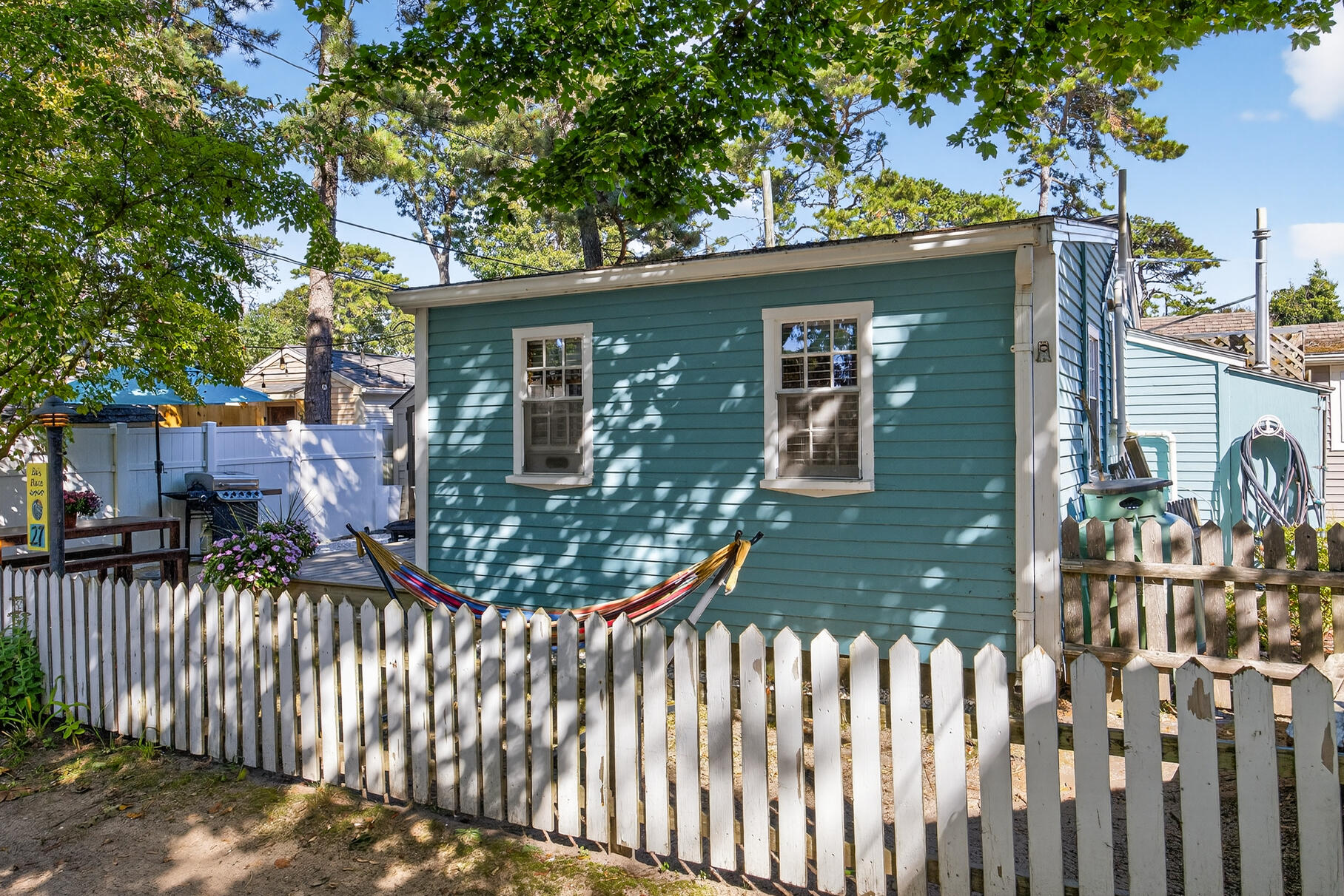 262 Old Wharf Road, Unit U27 Dennis Port, MA 02639 - Photo 28 of 37 a view of a house with wooden fence