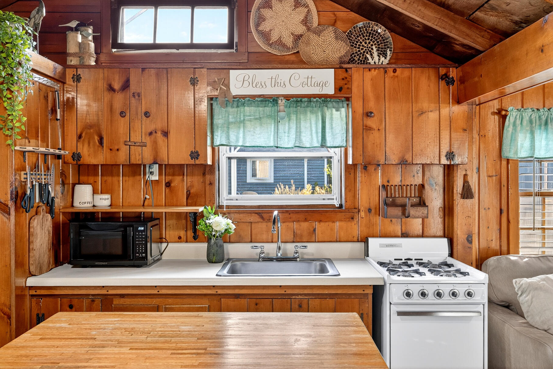 262 Old Wharf Road, Unit U27 Dennis Port, MA 02639 - Photo 6 of 37 a kitchen with stainless steel appliances kitchen island granite countertop a stove a sink and dishwasher