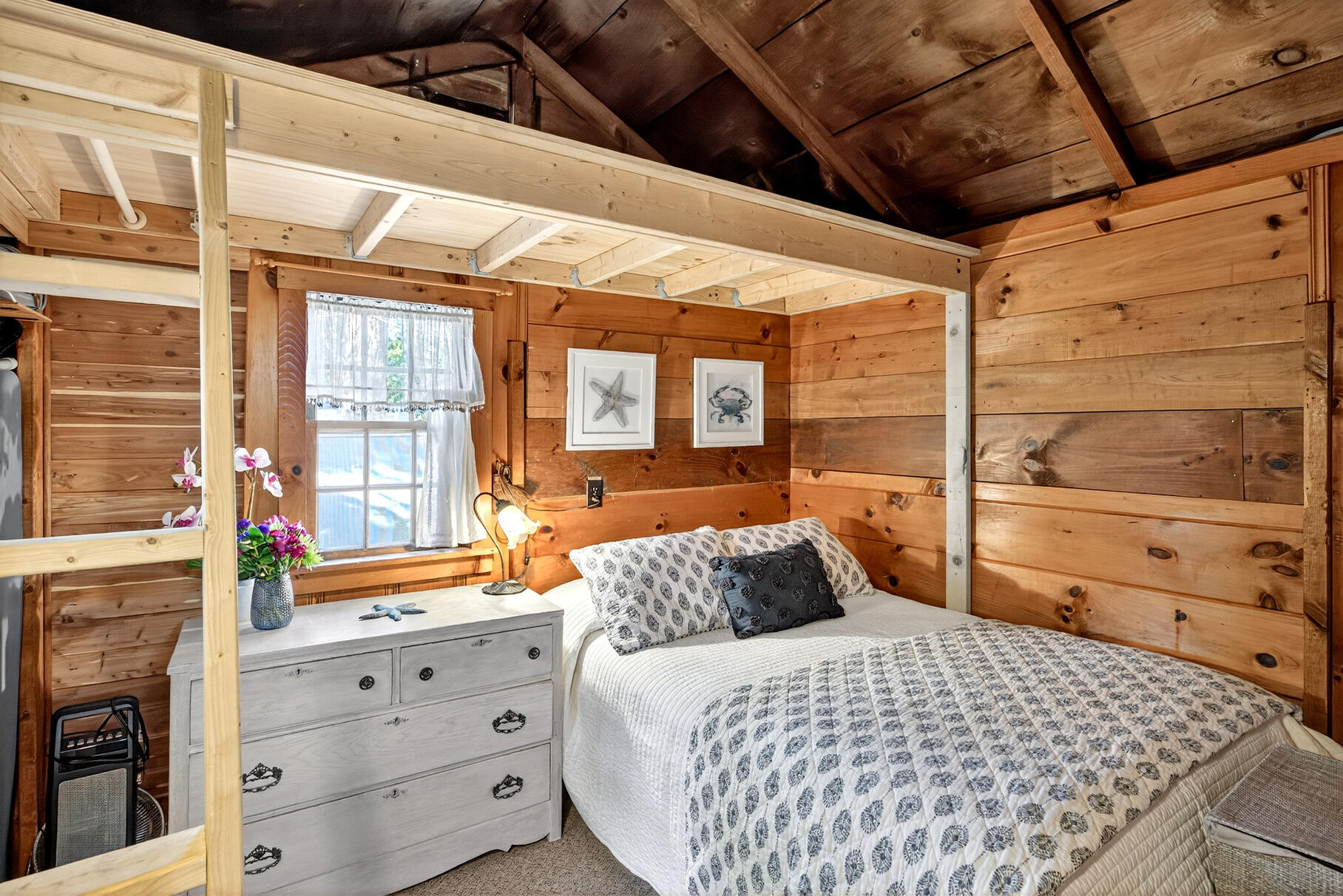 262 Old Wharf Road, Unit U27 Dennis Port, MA 02639 - Photo 8 of 37 a bedroom with a bed and wooden floor