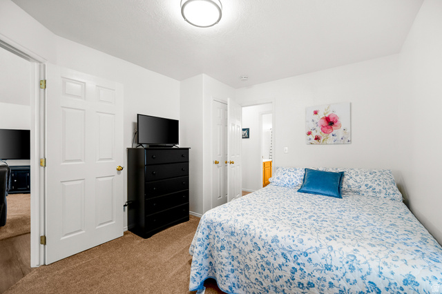 1825 West Mathis Park Place, Unit 46 St. George, UT 84770 - Photo 18 of 45 Bedroom featuring light carpet