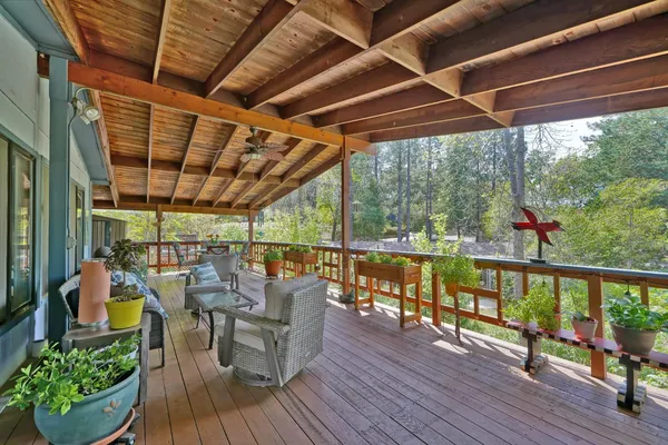 a view of sitting area with furniture and wooden floor