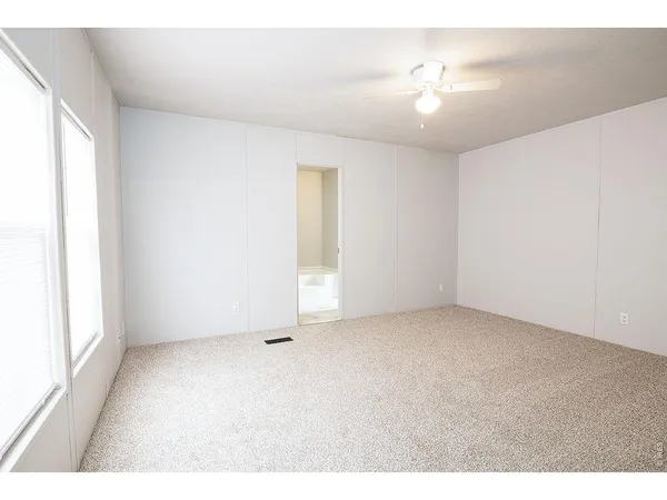 a view of an empty room with a window