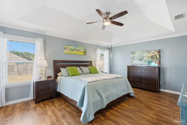 a bed room with a bed and a television