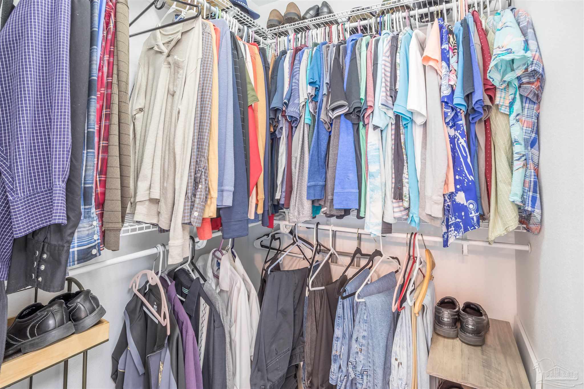 420 Collinwood Loop Foley, AL 36535 - Photo 30 of 63 a view of walk in closet with clothes