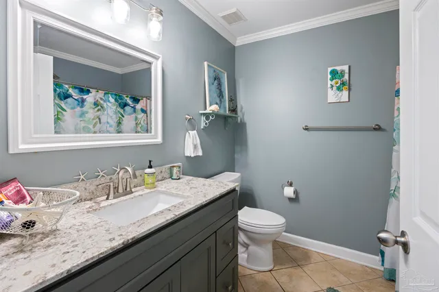 a view of a patio with table and chairs and a barbeque