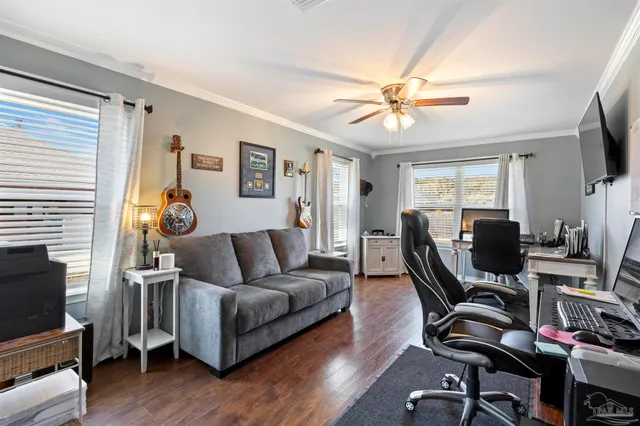 a living room with furniture and a flat screen tv