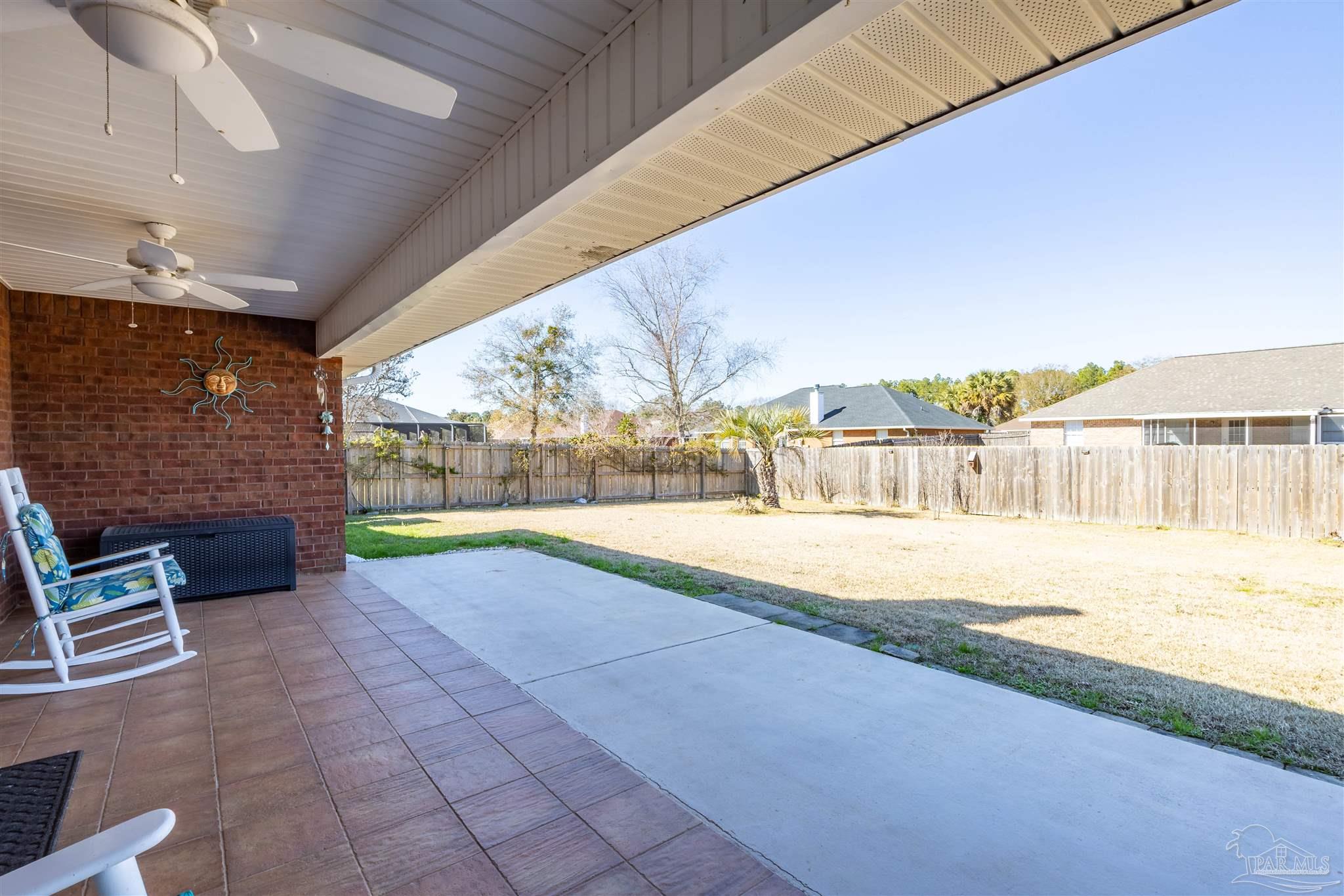 420 Collinwood Loop Foley, AL 36535 - Photo 44 of 63 a view of swimming pool with outdoor seating and a yard