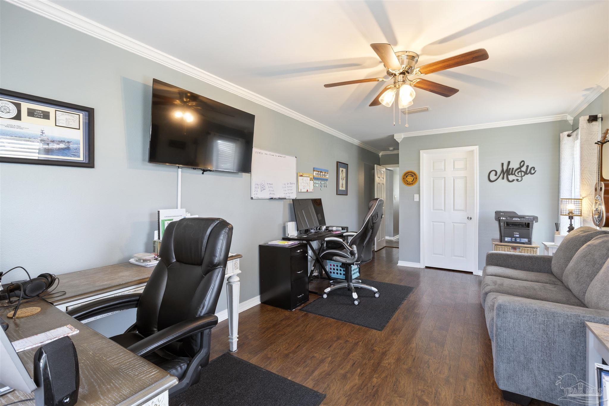 420 Collinwood Loop Foley, AL 36535 - Photo 5 of 63 a living room with furniture and a flat screen tv