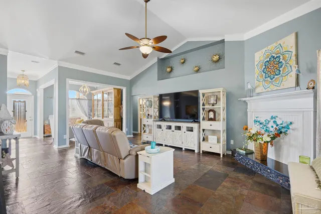 a dining room with furniture a chandelier and window