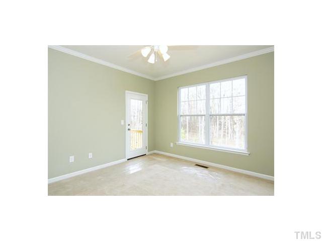 1241 Silver Beach Way Raleigh, NC 27606 - Photo 8 of 20 a view of an empty room with a window