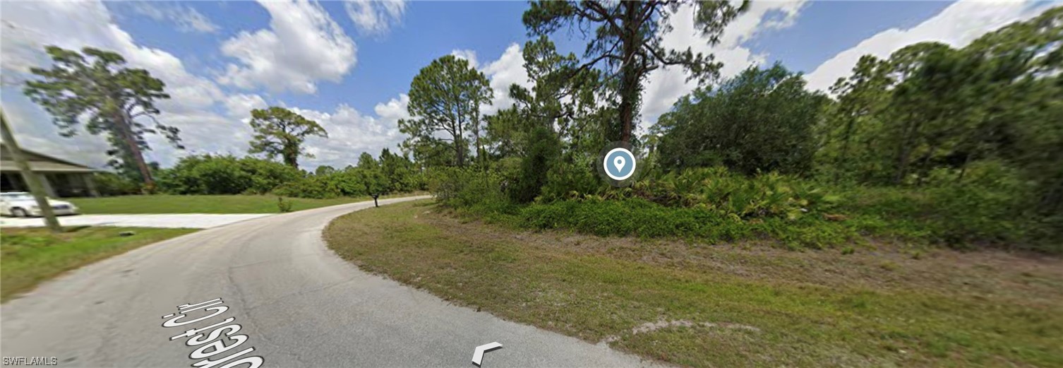 6525 Forest Circle LaBelle, FL 33935 - Photo 5 of 6 a view of a garden with a pathway