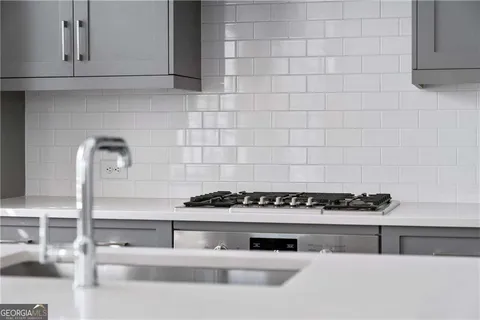 a bathroom with a bathtub and a window