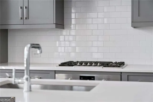 a bathroom with a bathtub and a window