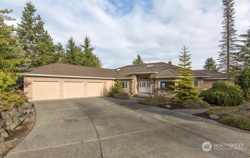 485 Doe Run Road Sequim, WA 98382 - Photo 1 of 40 front view of a house with a street