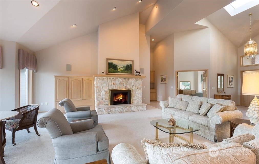 485 Doe Run Road Sequim, WA 98382 - Photo 12 of 40 a living room with furniture and a fireplace