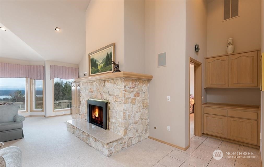 485 Doe Run Road Sequim, WA 98382 - Photo 13 of 40 a living room with furniture and a fireplace