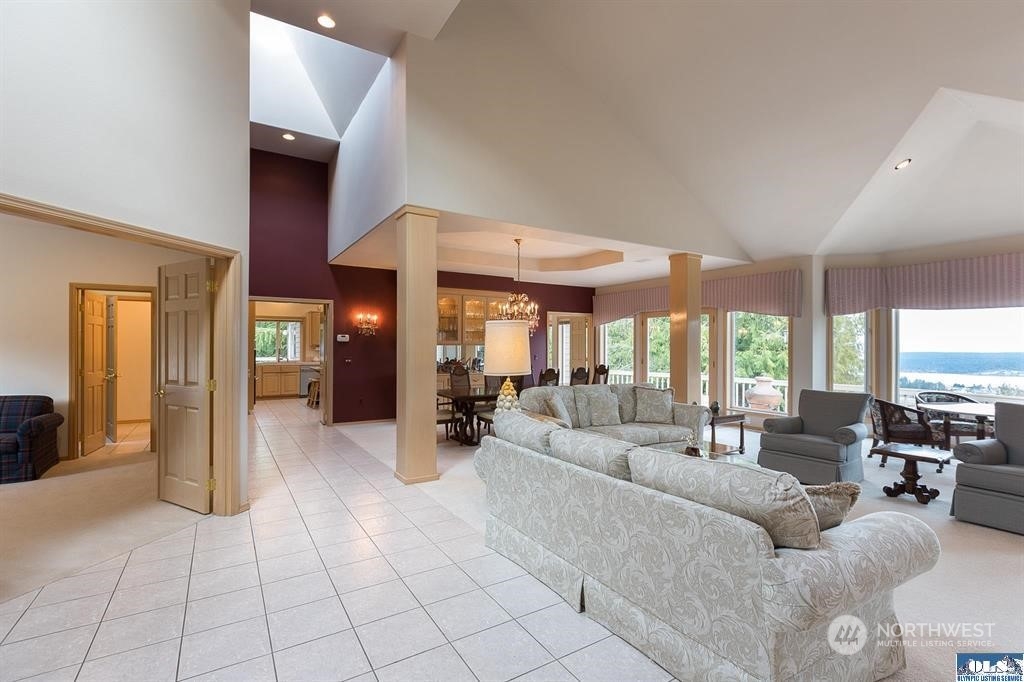 485 Doe Run Road Sequim, WA 98382 - Photo 16 of 40 a living room with furniture and a large window