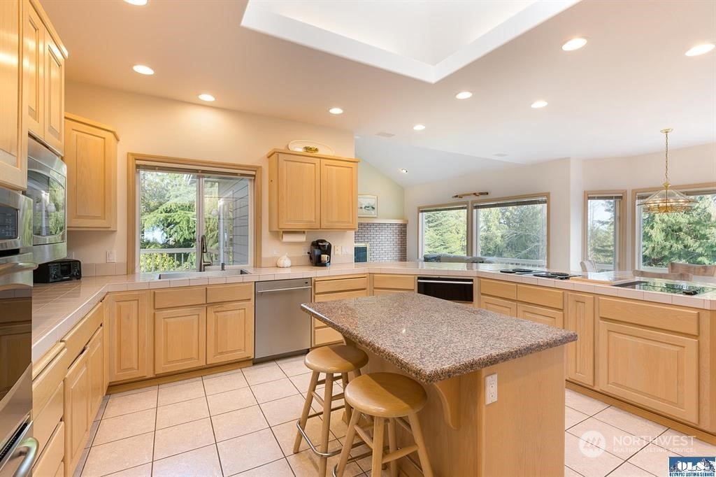 485 Doe Run Road Sequim, WA 98382 - Photo 19 of 40 a kitchen with sink cabinets and appliances