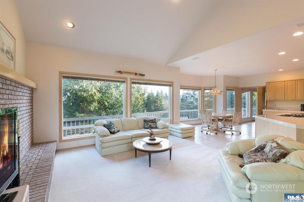 485 Doe Run Road Sequim, WA 98382 - Photo 23 of 40 a living room with furniture and a large window