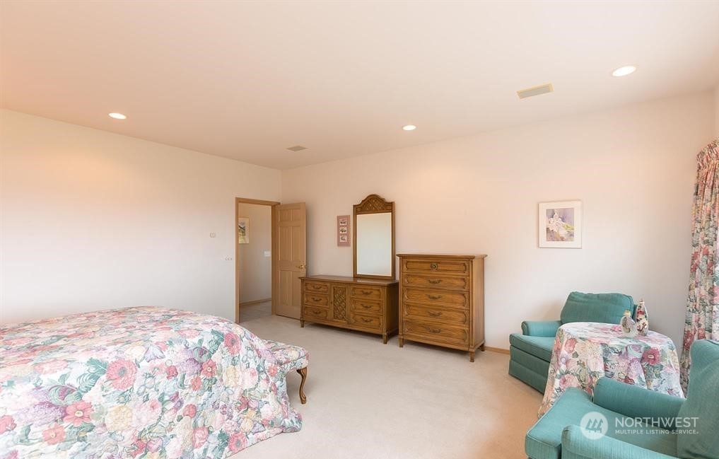 485 Doe Run Road Sequim, WA 98382 - Photo 26 of 40 a bedroom with a bed and furniture