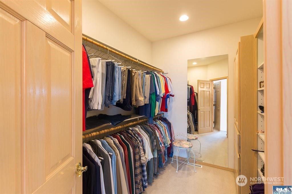 485 Doe Run Road Sequim, WA 98382 - Photo 31 of 40 a view of walk in closet with clothes and shoes