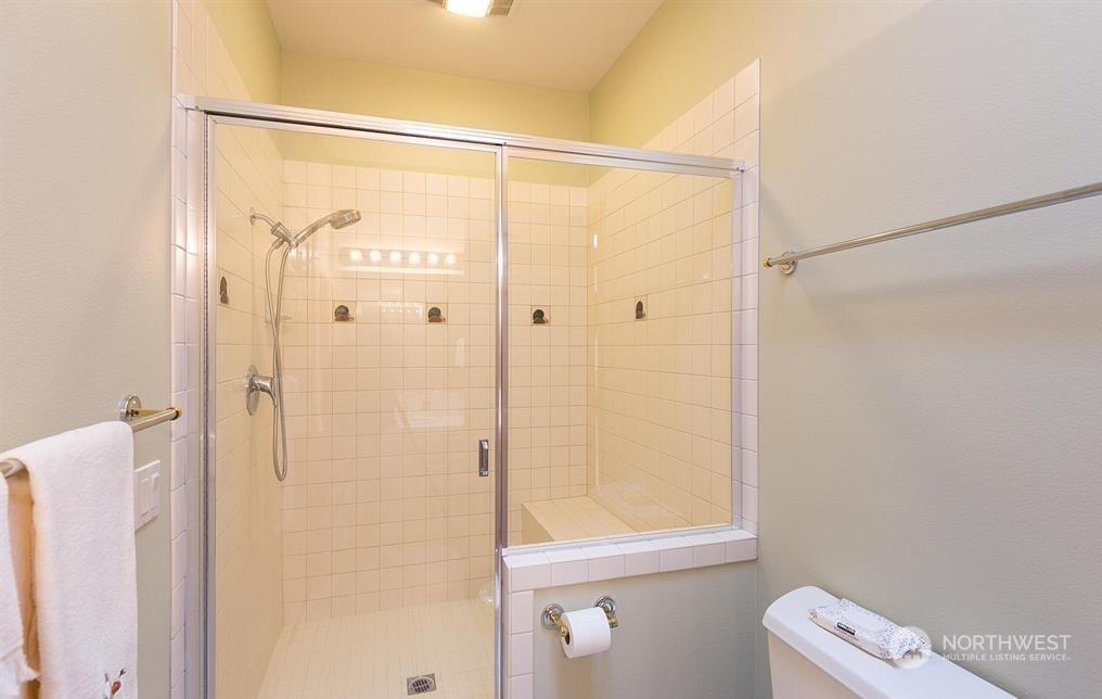 485 Doe Run Road Sequim, WA 98382 - Photo 35 of 40 a bathroom with a shower and a toilet