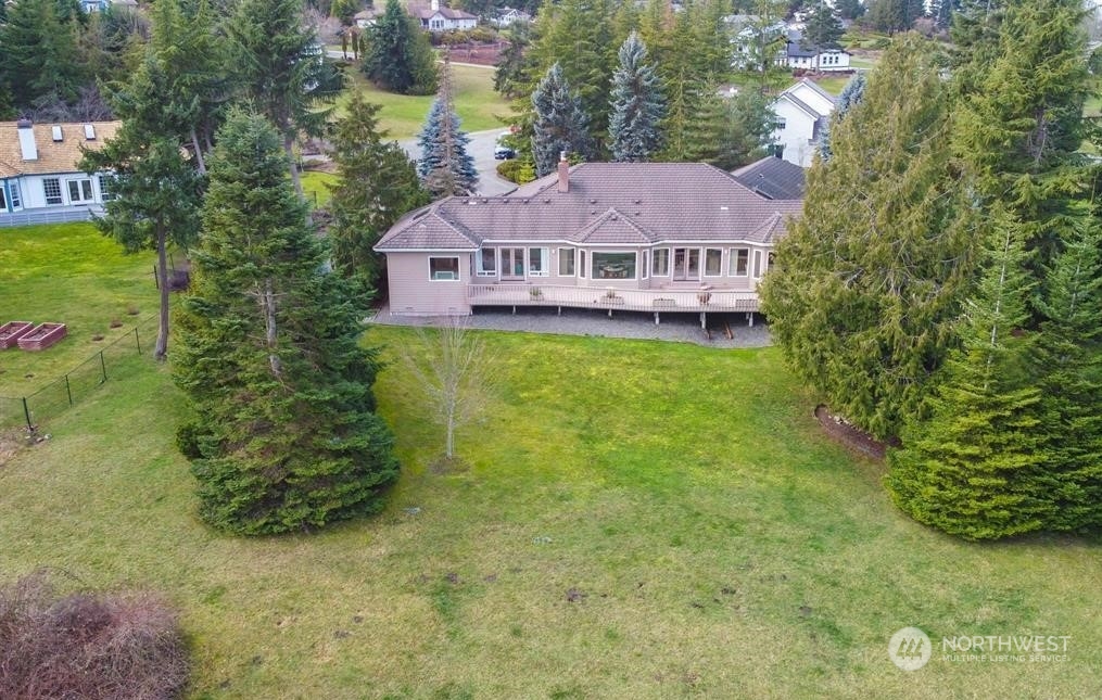 485 Doe Run Road Sequim, WA 98382 - Photo 4 of 40 a view of a house with a garden