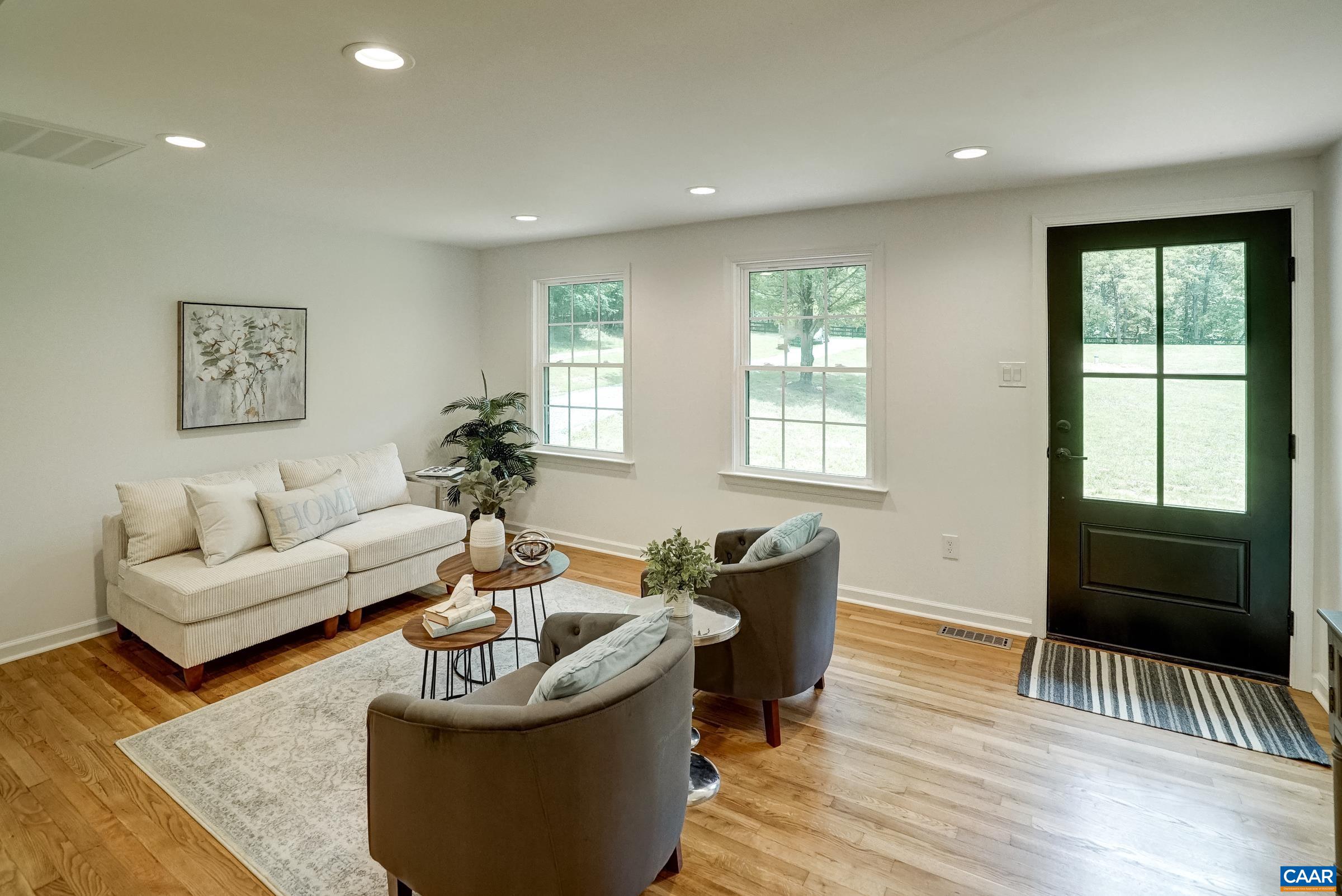 1038 Smith Road Afton, VA 22920 - Photo 10 of 49 a living room with furniture and a flat screen tv