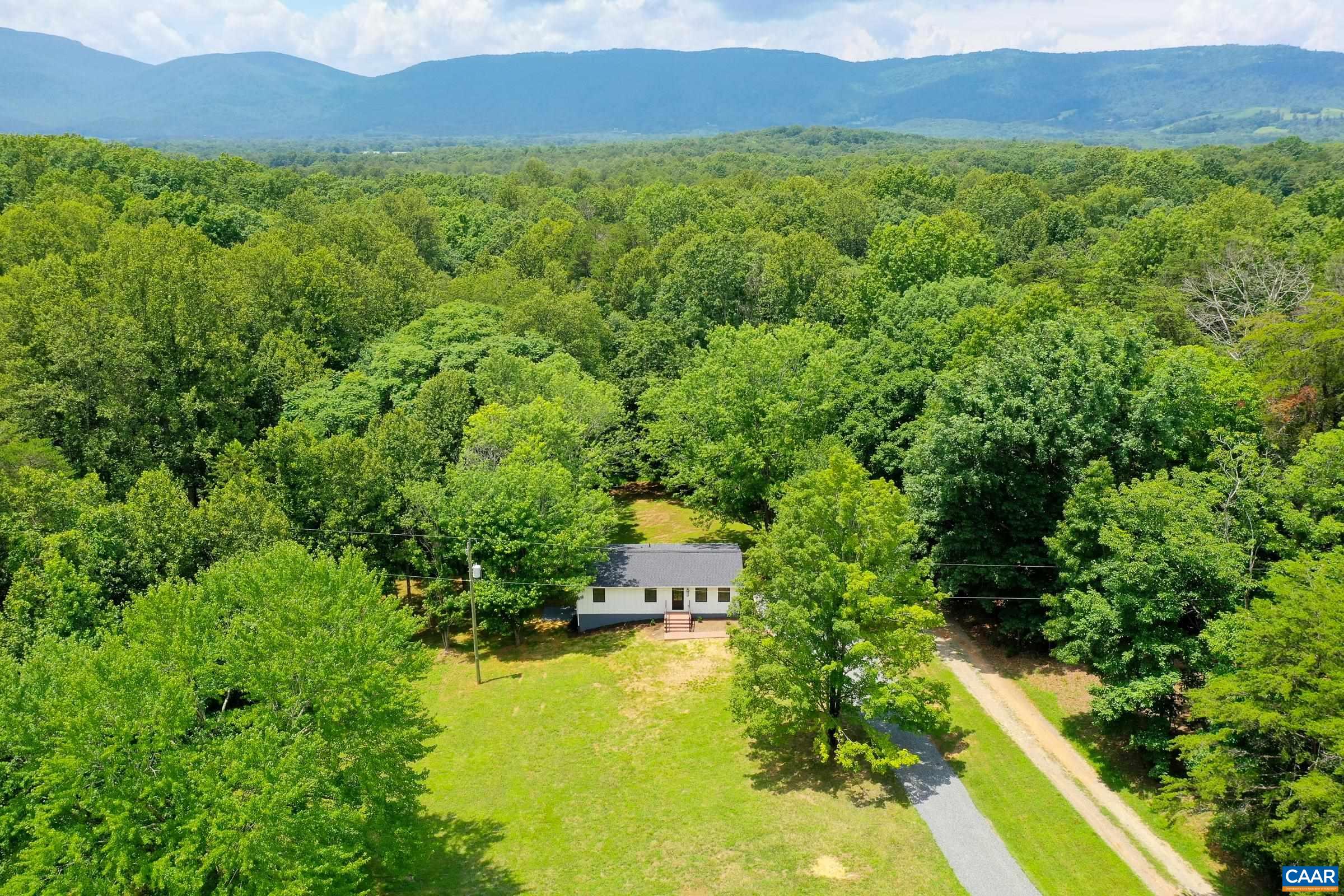 1038 Smith Road Afton, VA 22920 - Photo 2 of 49 a view of a lush green forest with a house