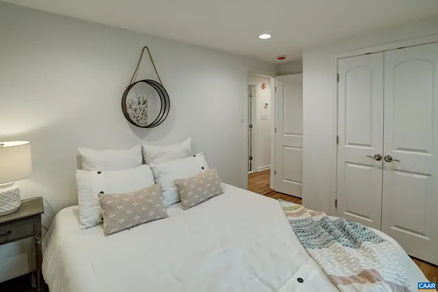 a bedroom with a bed and window