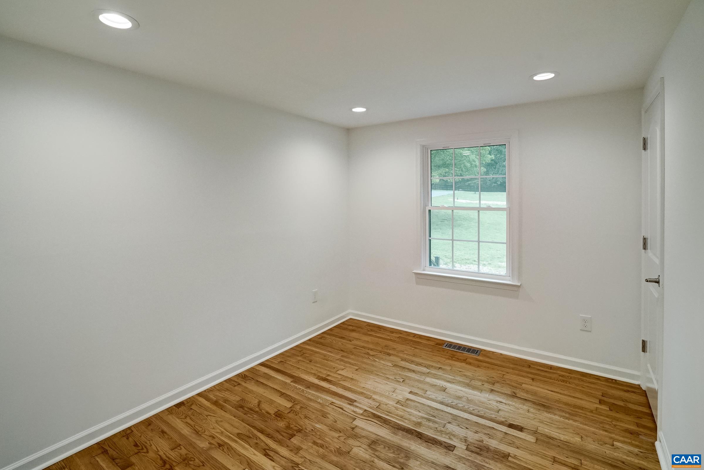 1038 Smith Road Afton, VA 22920 - Photo 23 of 49 an empty room with wooden floor and windows