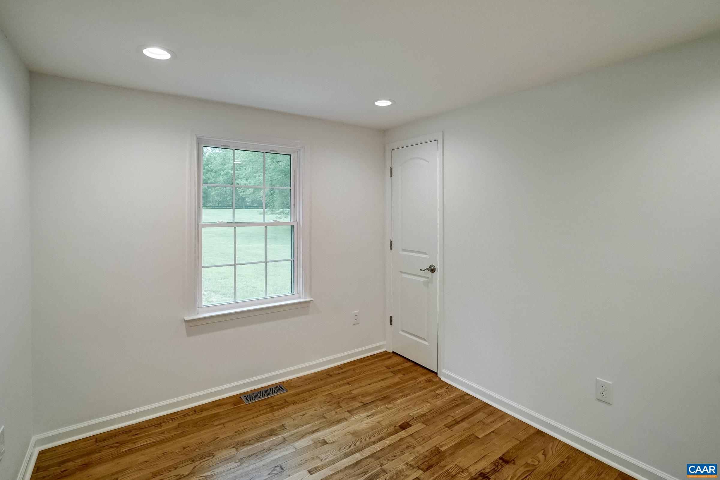 1038 Smith Road Afton, VA 22920 - Photo 24 of 49 an empty room with wooden floor and windows