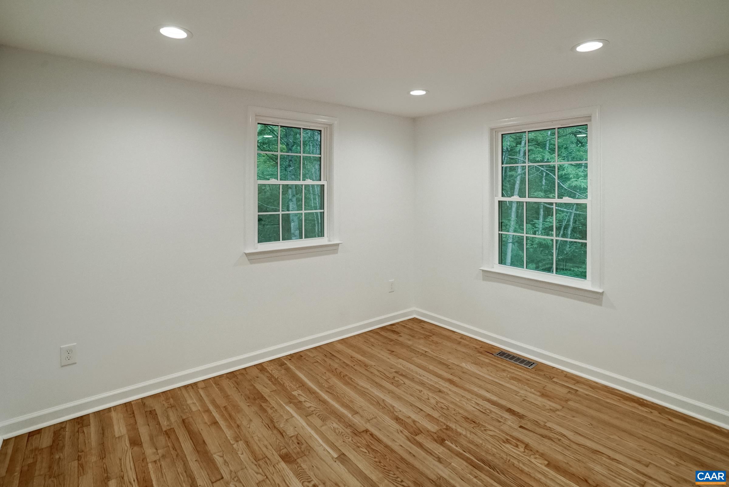 1038 Smith Road Afton, VA 22920 - Photo 25 of 49 an empty room with wooden floor and windows