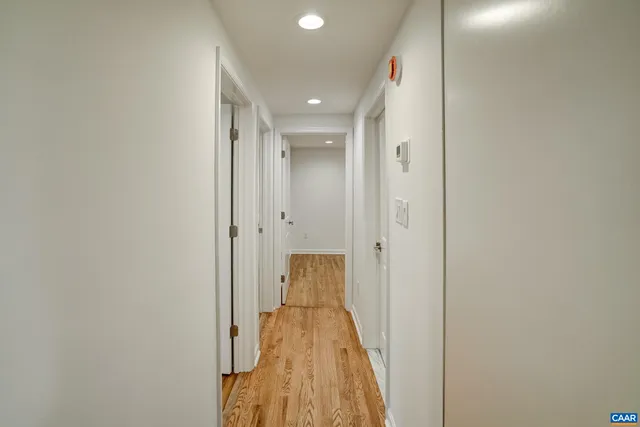 a bathroom with a shower sink vanity granite and mirror
