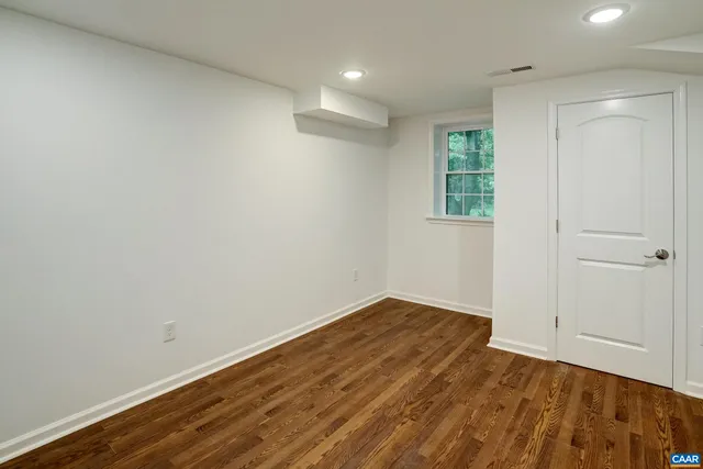 a bathroom with a sink mirror vanity and toilet
