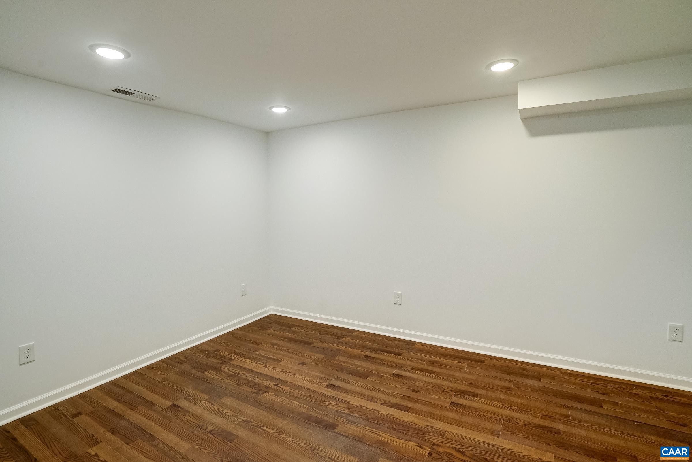 1038 Smith Road Afton, VA 22920 - Photo 35 of 49 a view of room with wooden floor and fan