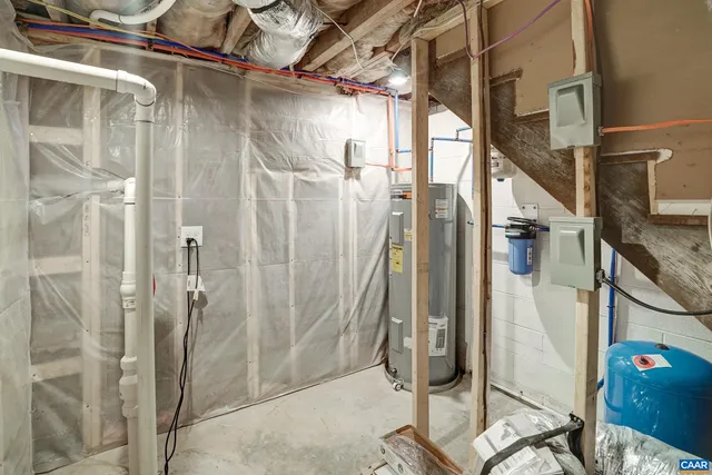 a bathroom with a shower and a glass door