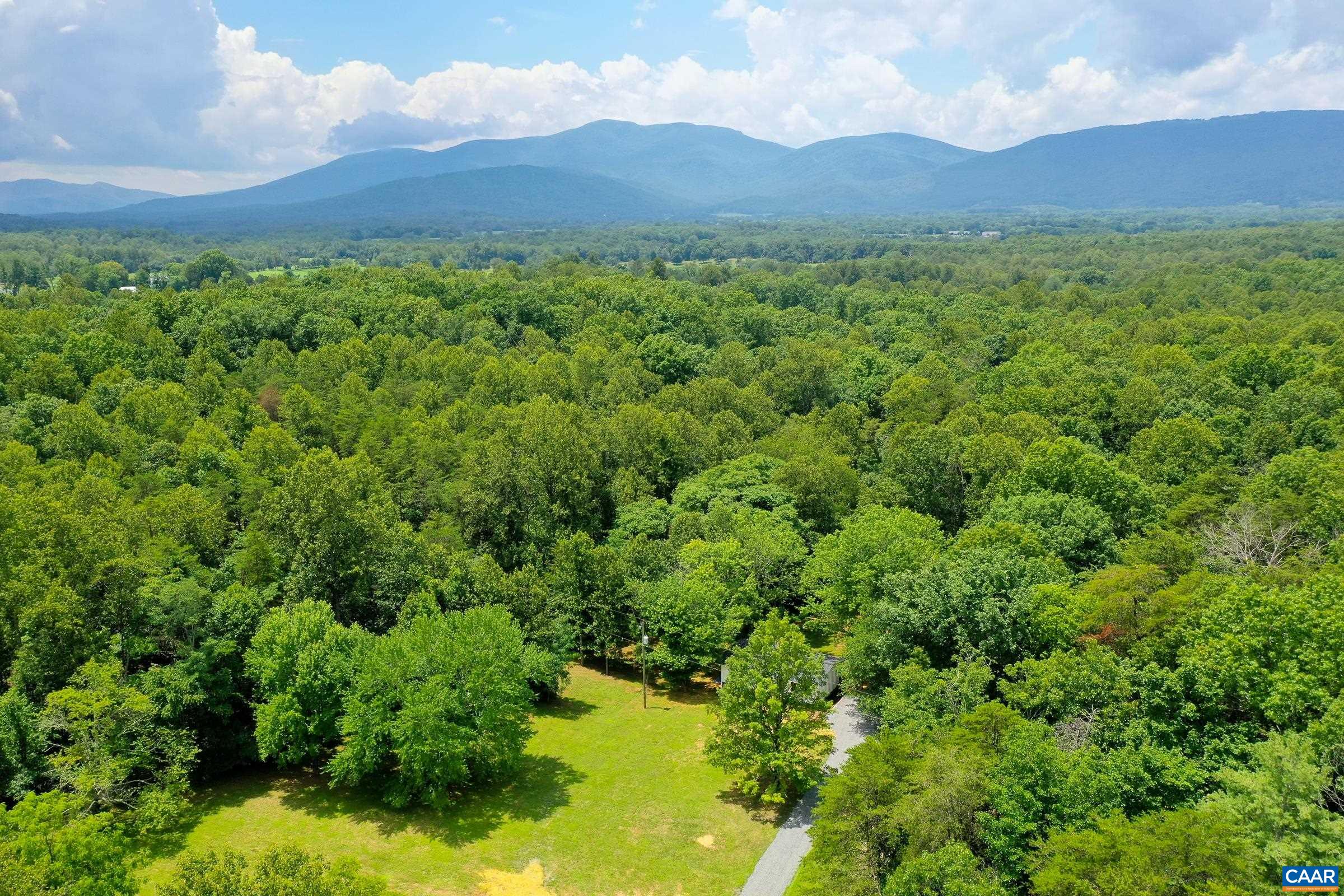 1038 Smith Road Afton, VA 22920 - Photo 41 of 49 a view of a lush green hillside and a houses