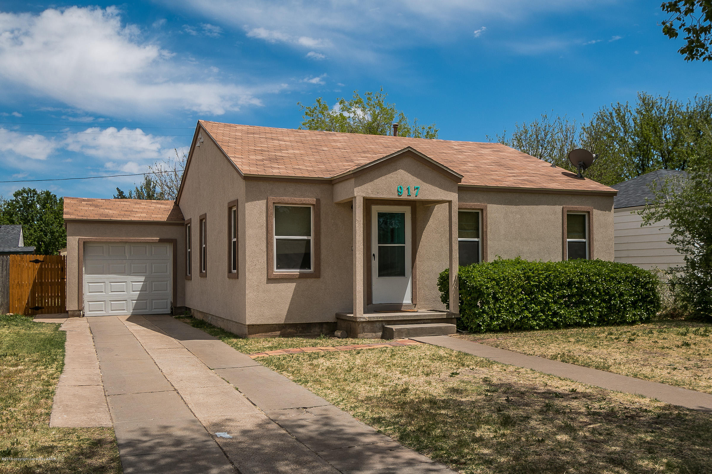 917 South Rusk Street Amarillo, TX 79102 - Photo 1 of 13 a front view of a house with a garden