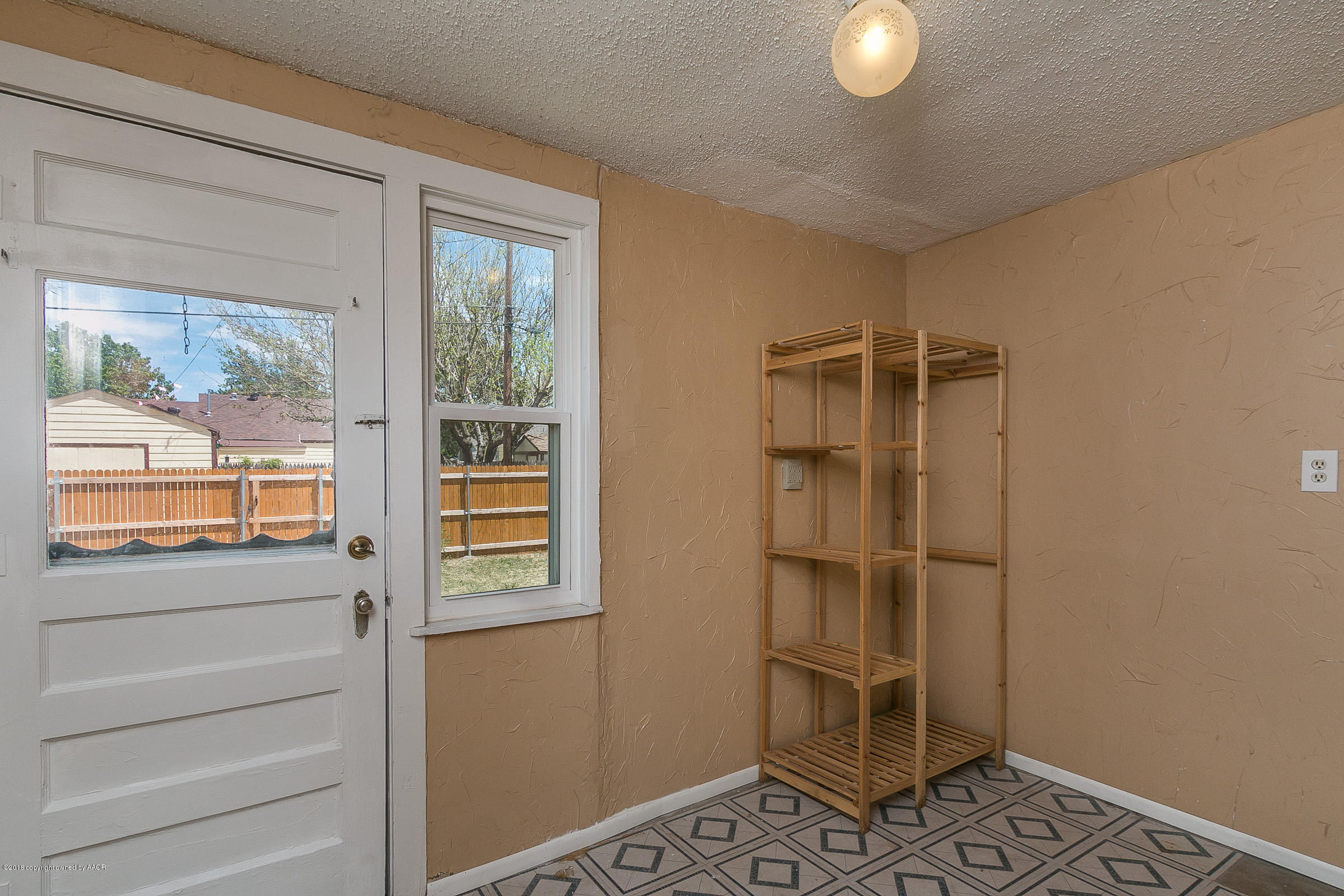 917 South Rusk Street Amarillo, TX 79102 - Photo 11 of 13 a view of an empty room with a window